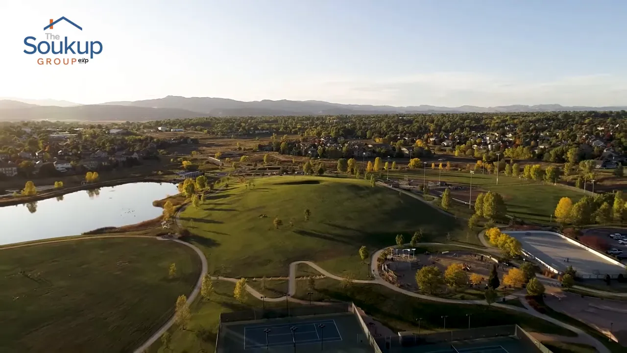 Aerial view of Fort Collins neighborhood with parks and green space in clear daylight