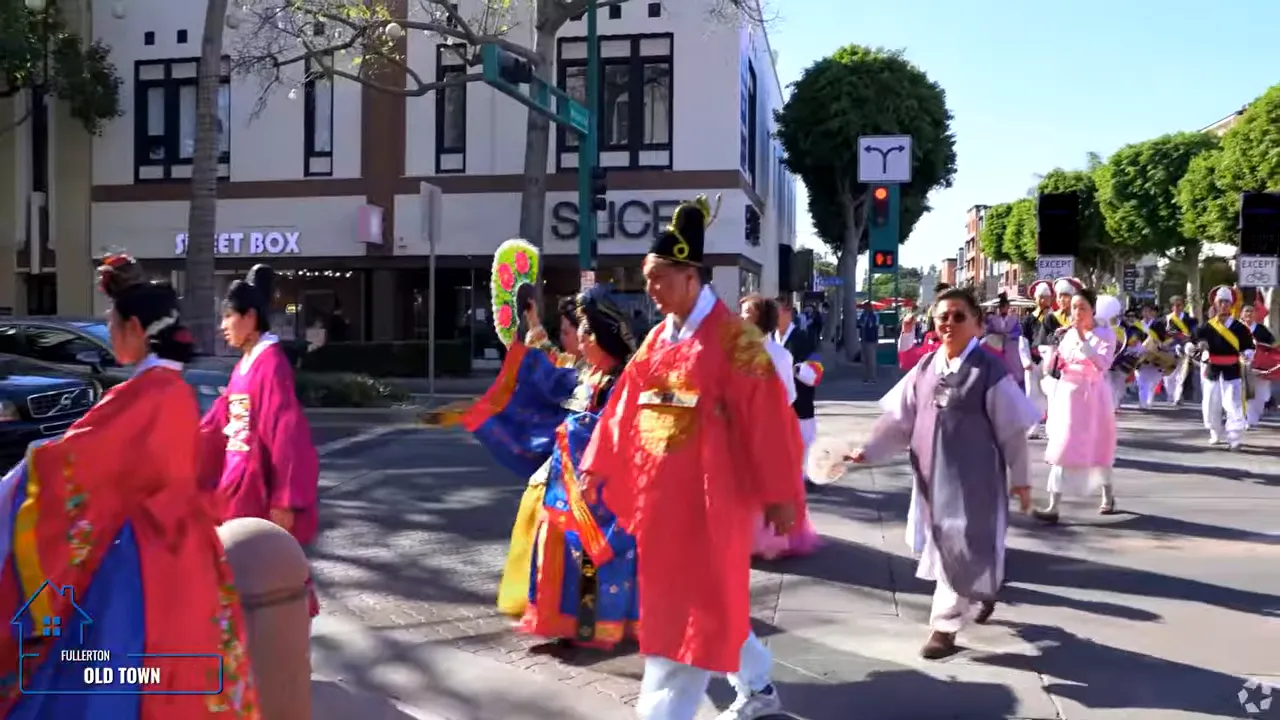 People in colorful traditional clothing walking in Old Town Fullerton