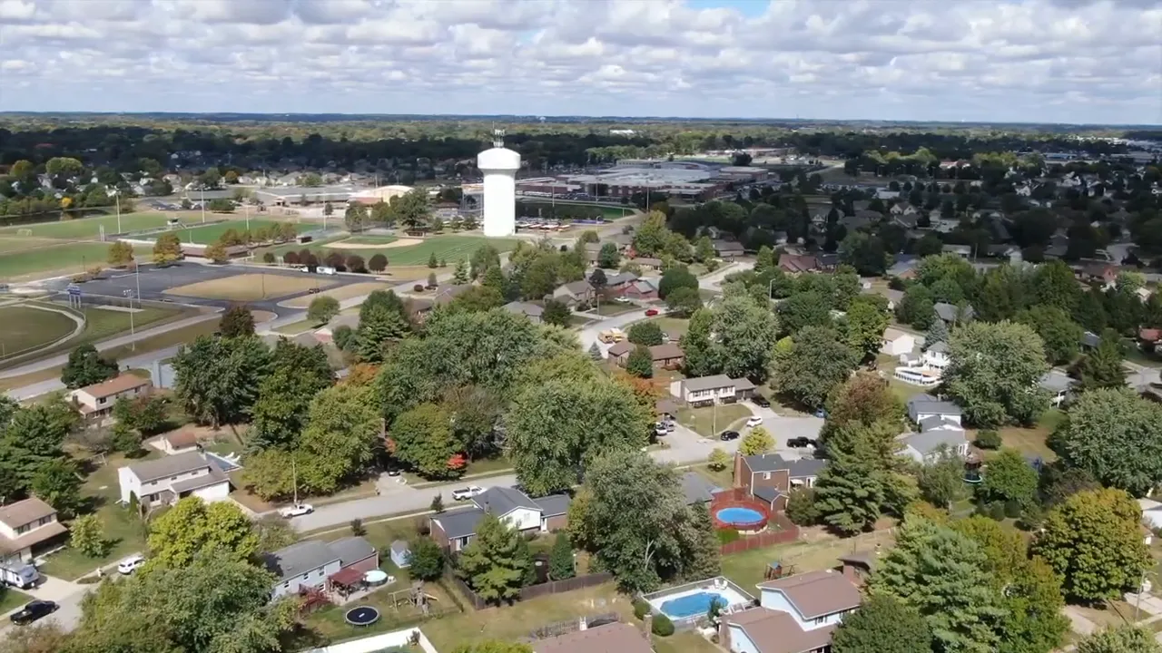 Aerial view of a large school building with surrounding neighborhood streets