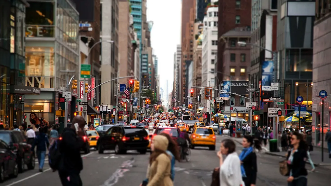 Busy city street filled with traffic and pedestrians