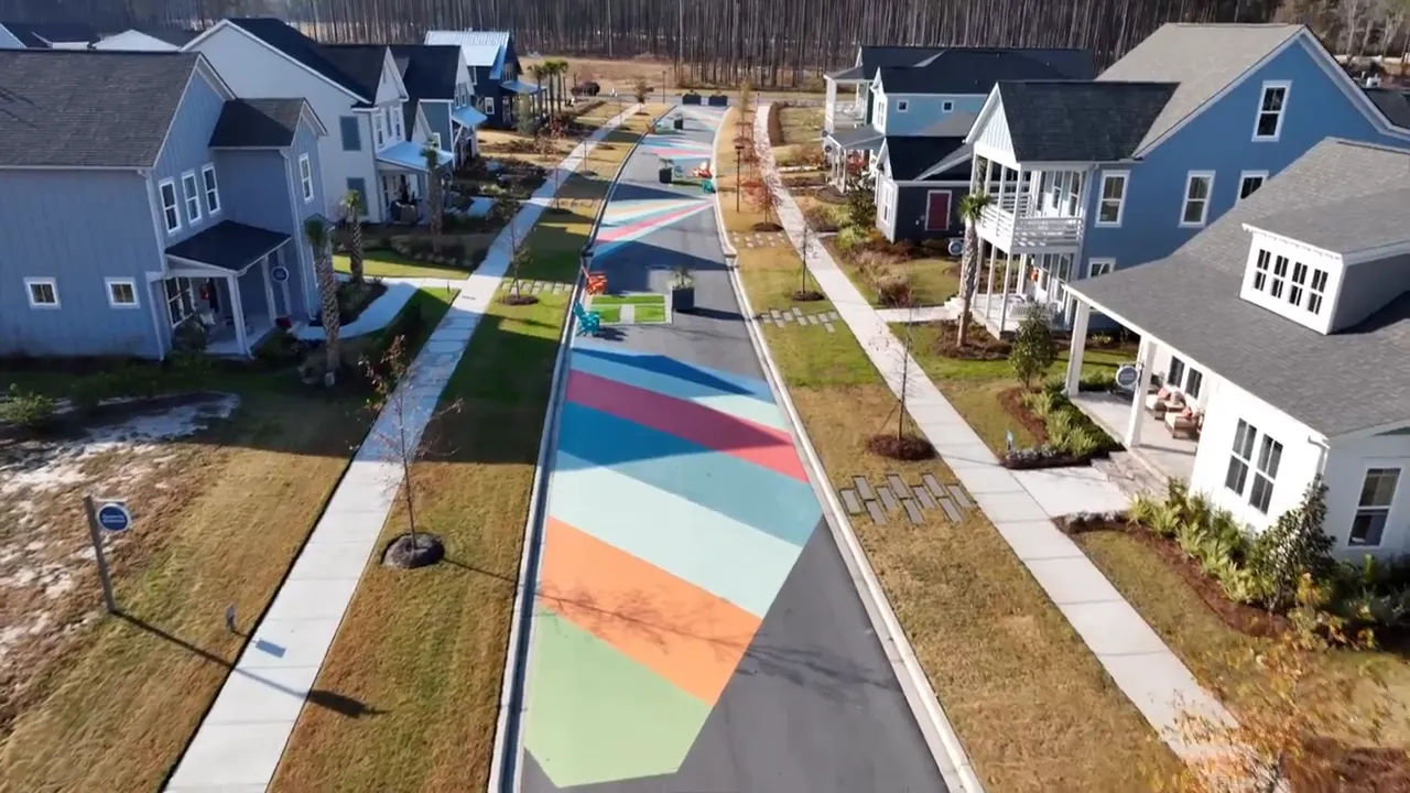 Colorful planned neighborhood street lined with newer homes