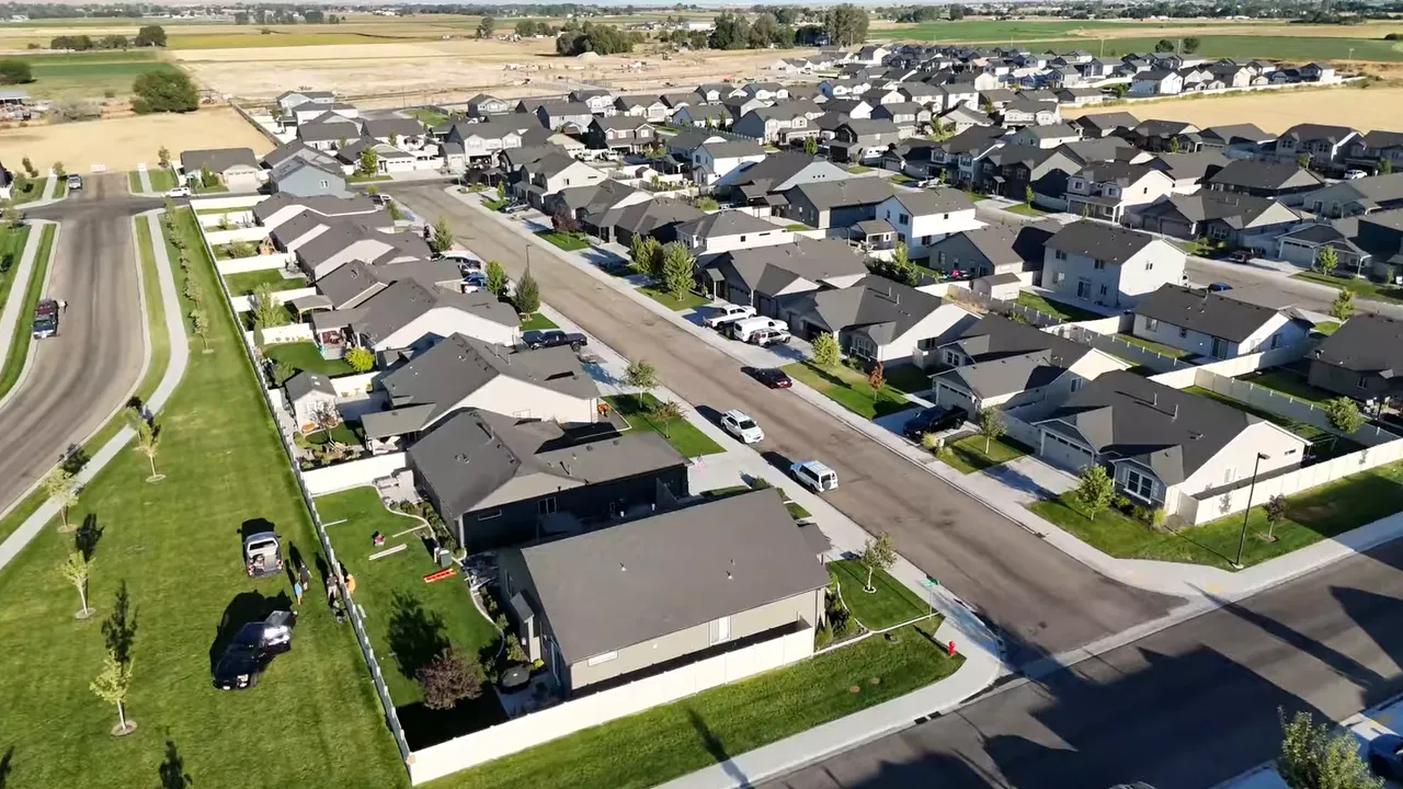 Aerial view of a newer suburban neighborhood in Kuna with many homes