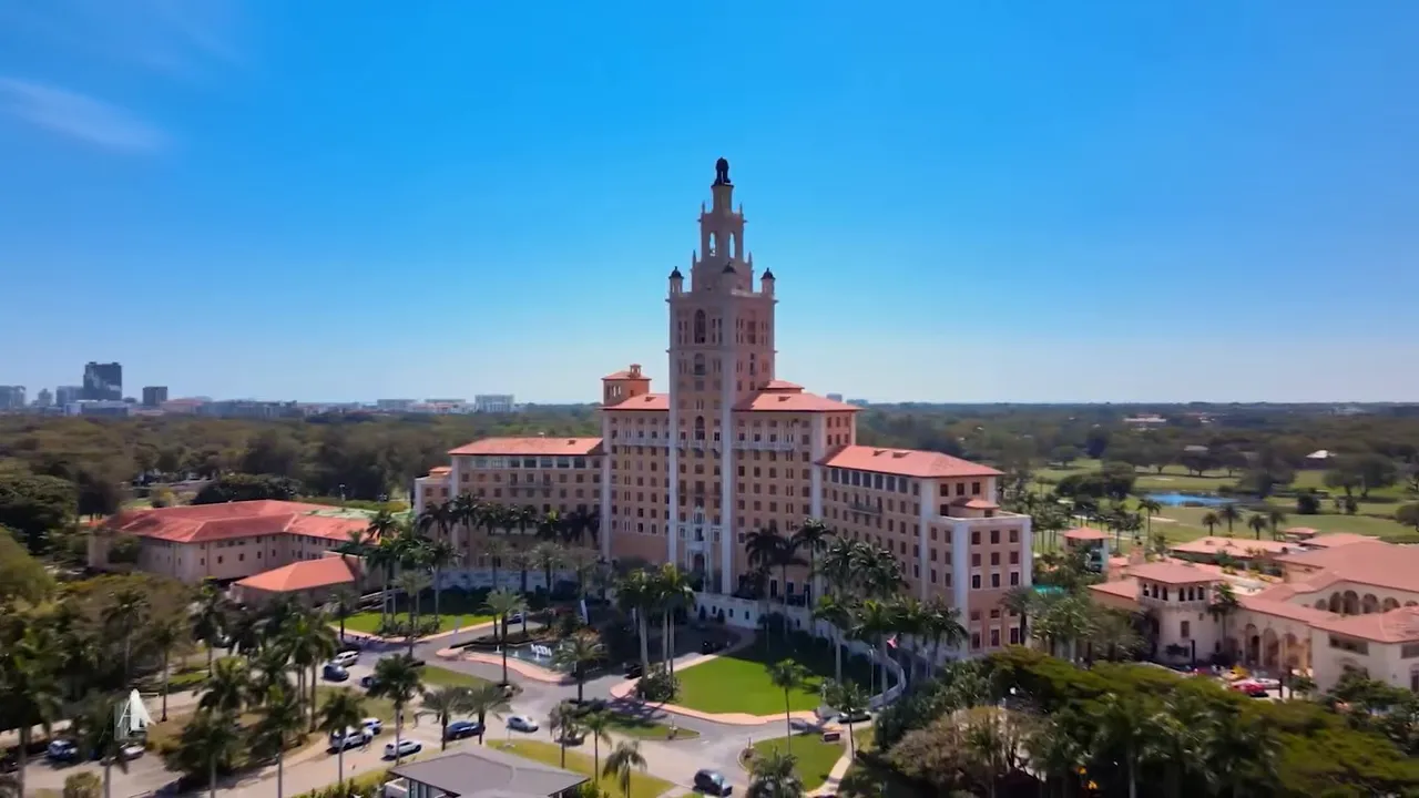 Aerial view of Coral Gables historic-style building and surrounding greenery in South Florida
