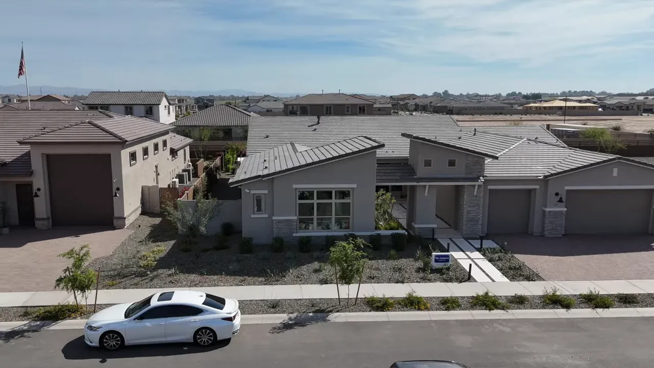 single-story homes with large driveways and an RV garage on a wide street