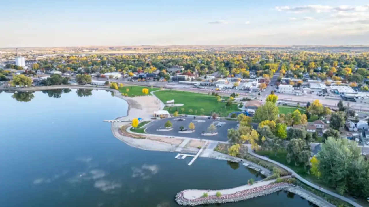 Aerial view of lakeside park beach and surrounding neighborhood