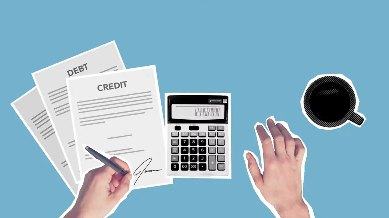 Hand writing on paperwork beside a calculator on a desk