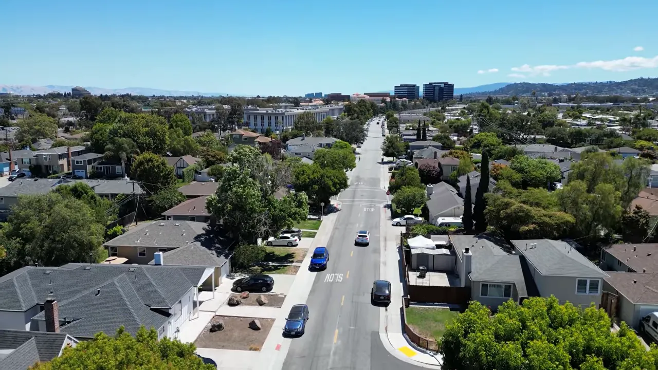 Aerial view over Sunnybrae neighborhood with single-family homes and main streets in San Mateo