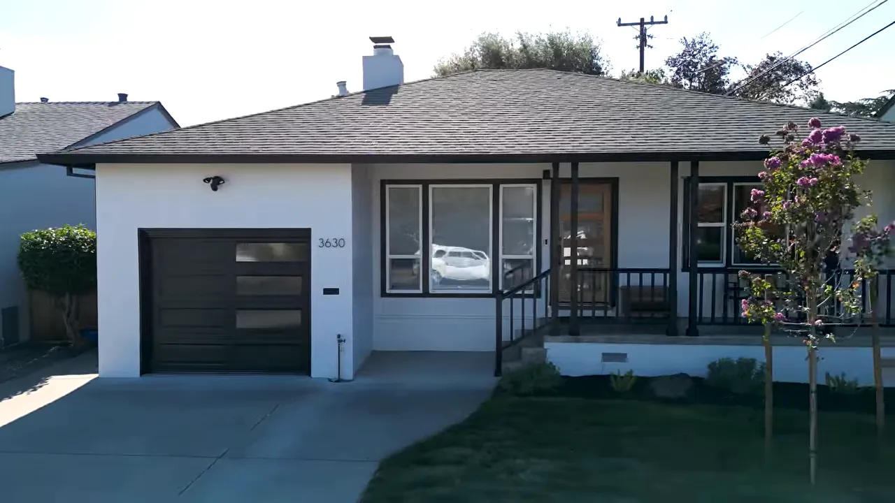 Single-family home exterior in San Mateo with an attached garage and front walkway