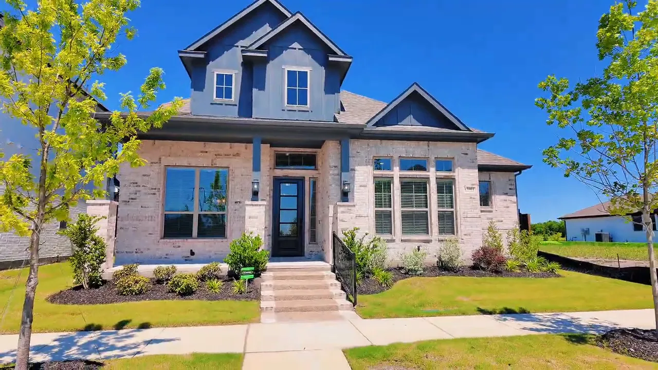 Front exterior of a new construction home near Dallas with landscaped yard and covered porch
