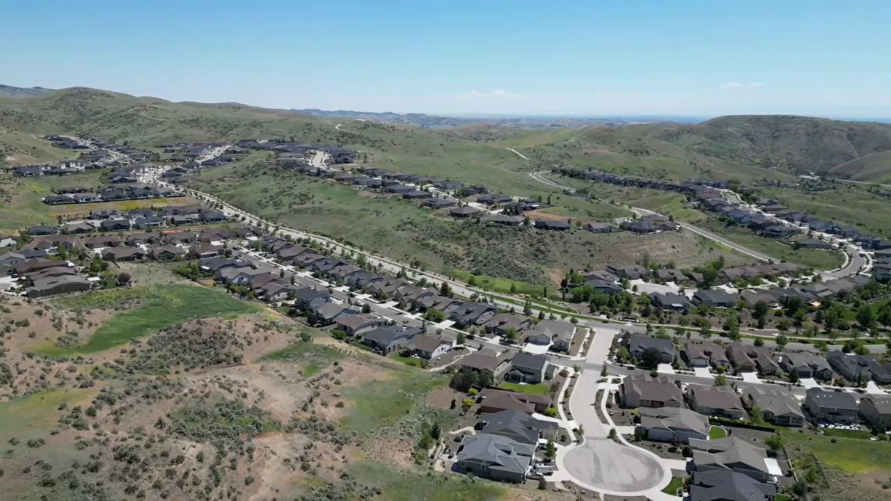 Aerial view of Avimor homes surrounded by open foothills