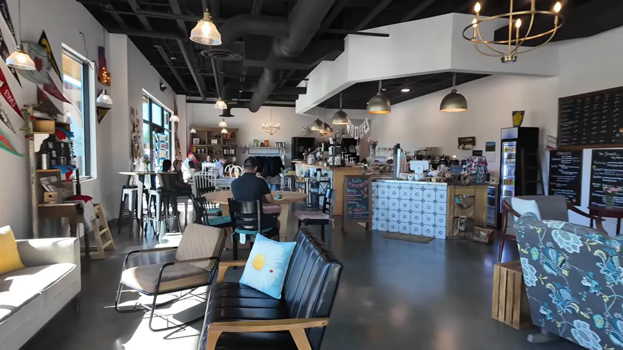 Interior of the Avimor neighborhood coffee shop with seating and counter