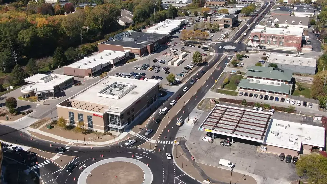 Clear aerial view of roundabout, Walgreens and surrounding commercial streets in Carmel, Indiana