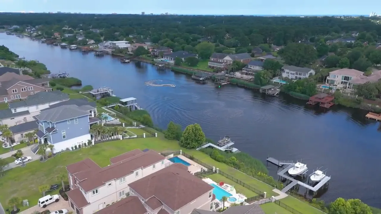 Aerial view of Carolina Waterway Plantation waterfront homes with docks and boat storage in Myrtle Beach SC