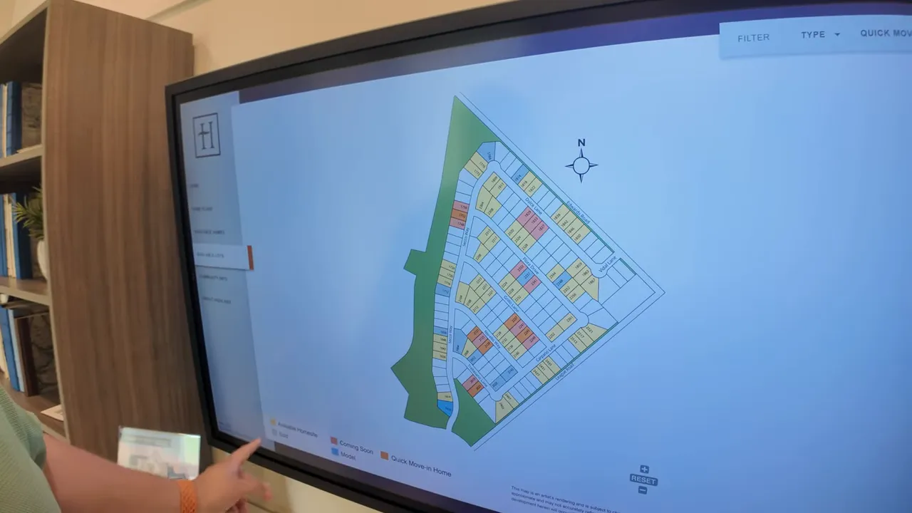 Community lot map on touchscreen with colored homesites and greenbelt areas