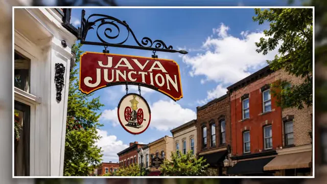 Java Junction hanging sign above downtown brick buildings