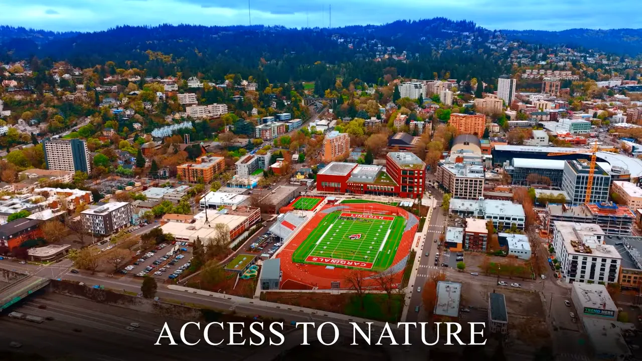Aerial view of Portland with a stadium and surrounding neighborhoods, showing access to nature