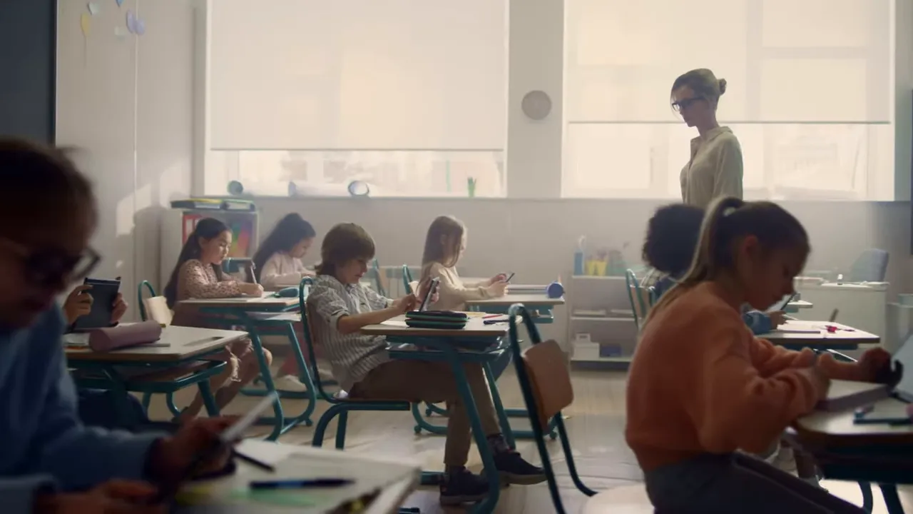 Classroom with teacher standing among students at desks
