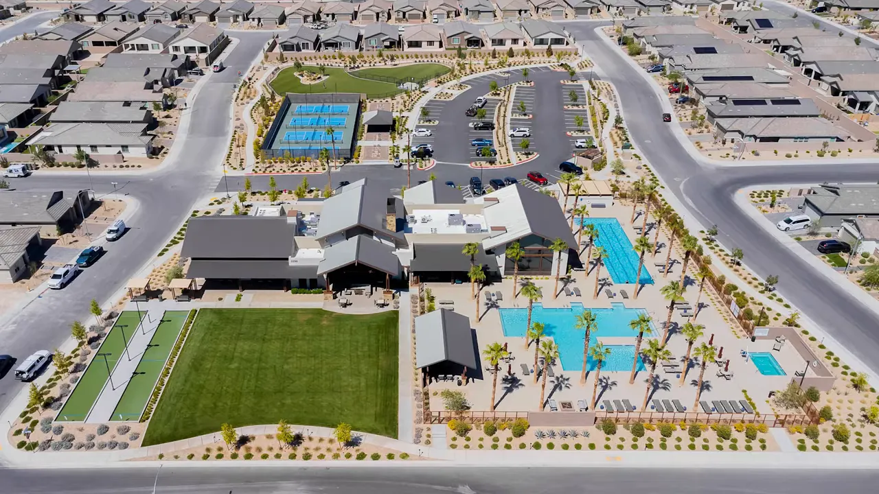 Aerial view of North Ranch clubhouse pools and event lawn with opened in 2021 text