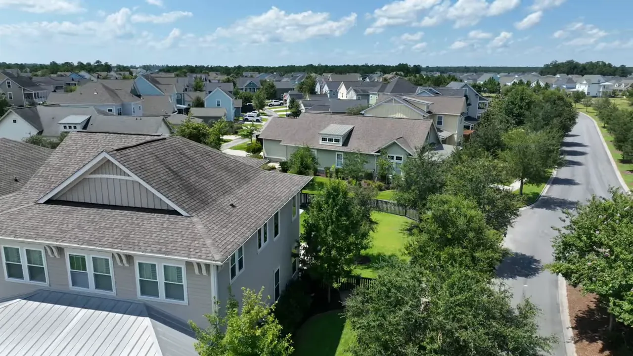 Aerial drone photo of a Summerville neighborhood showing houses, tree-lined streets, and yards