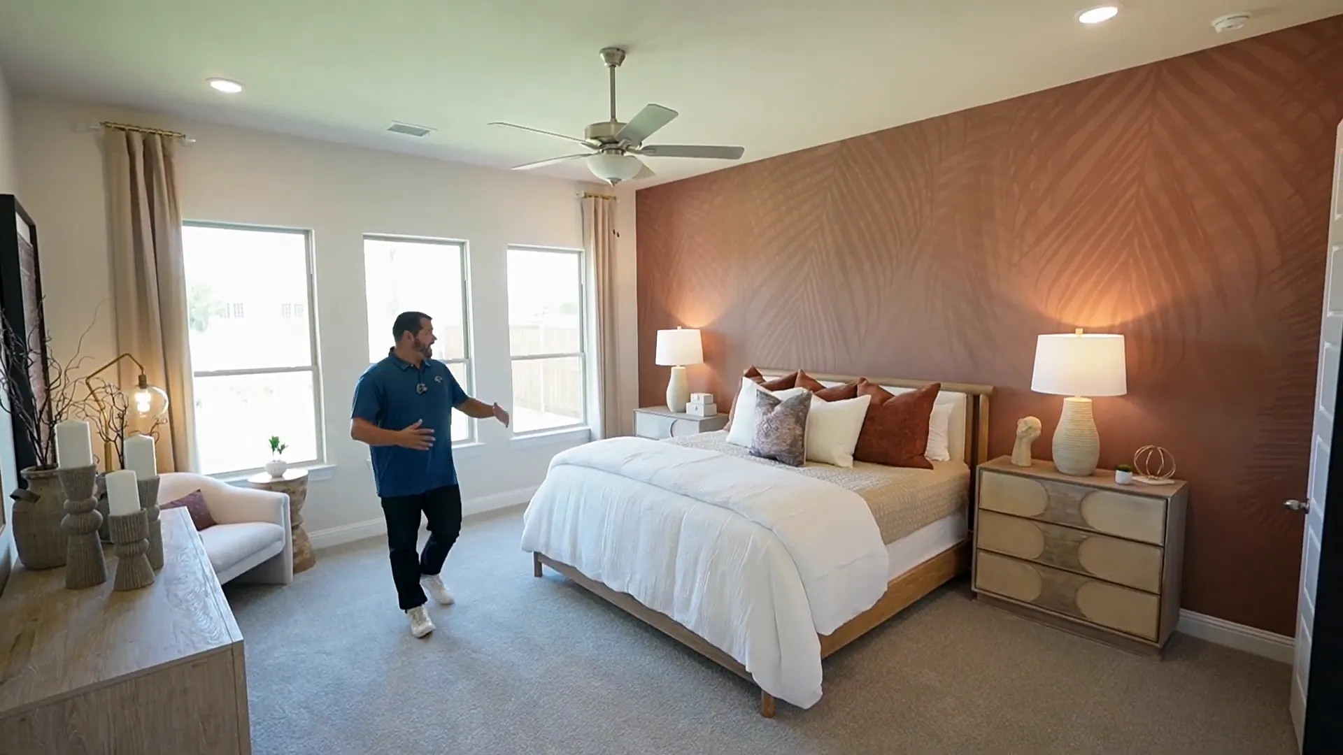 Spacious primary suite with sitting area and windows
