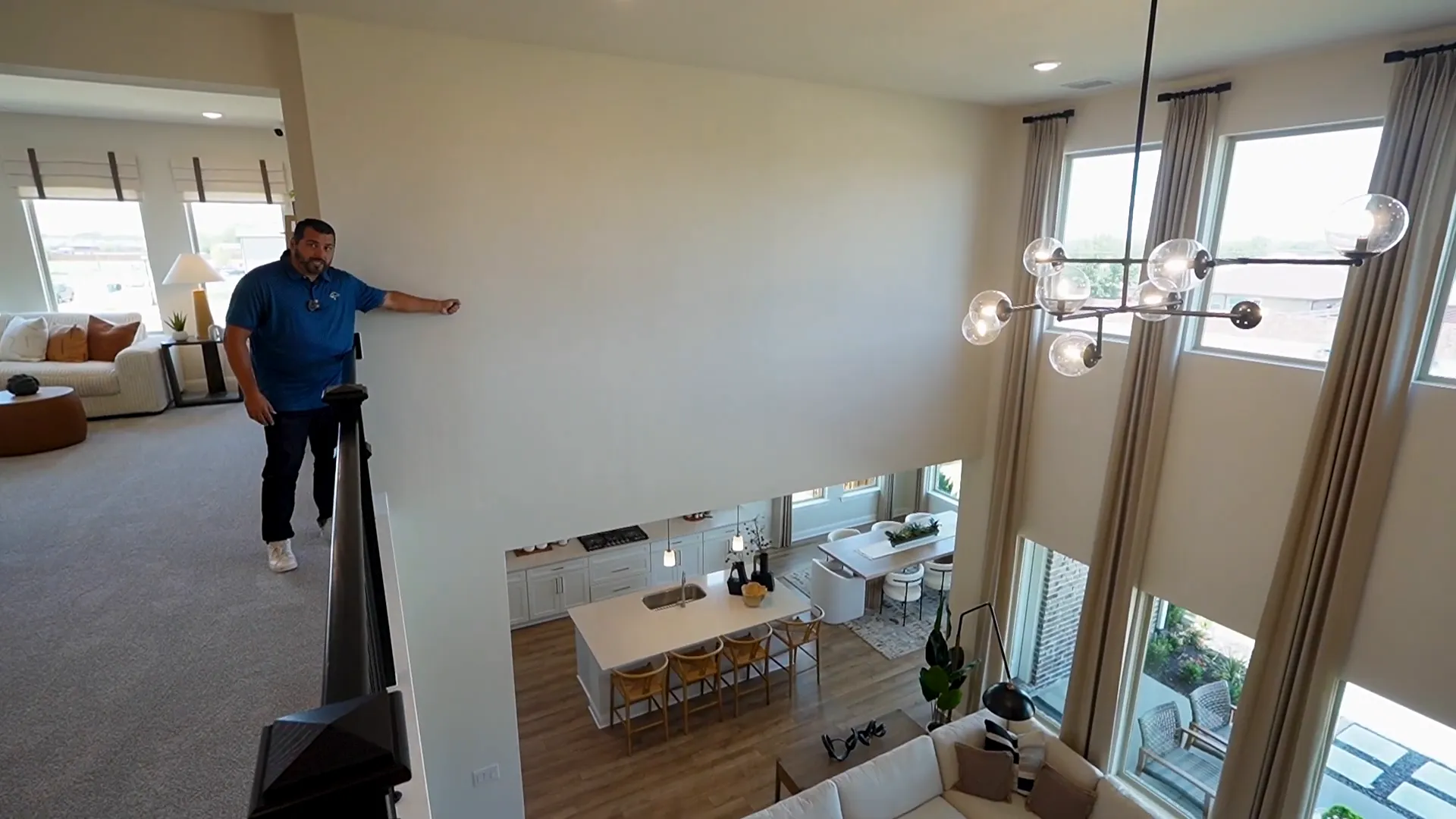 Upstairs entertainment/game room with oversized windows
