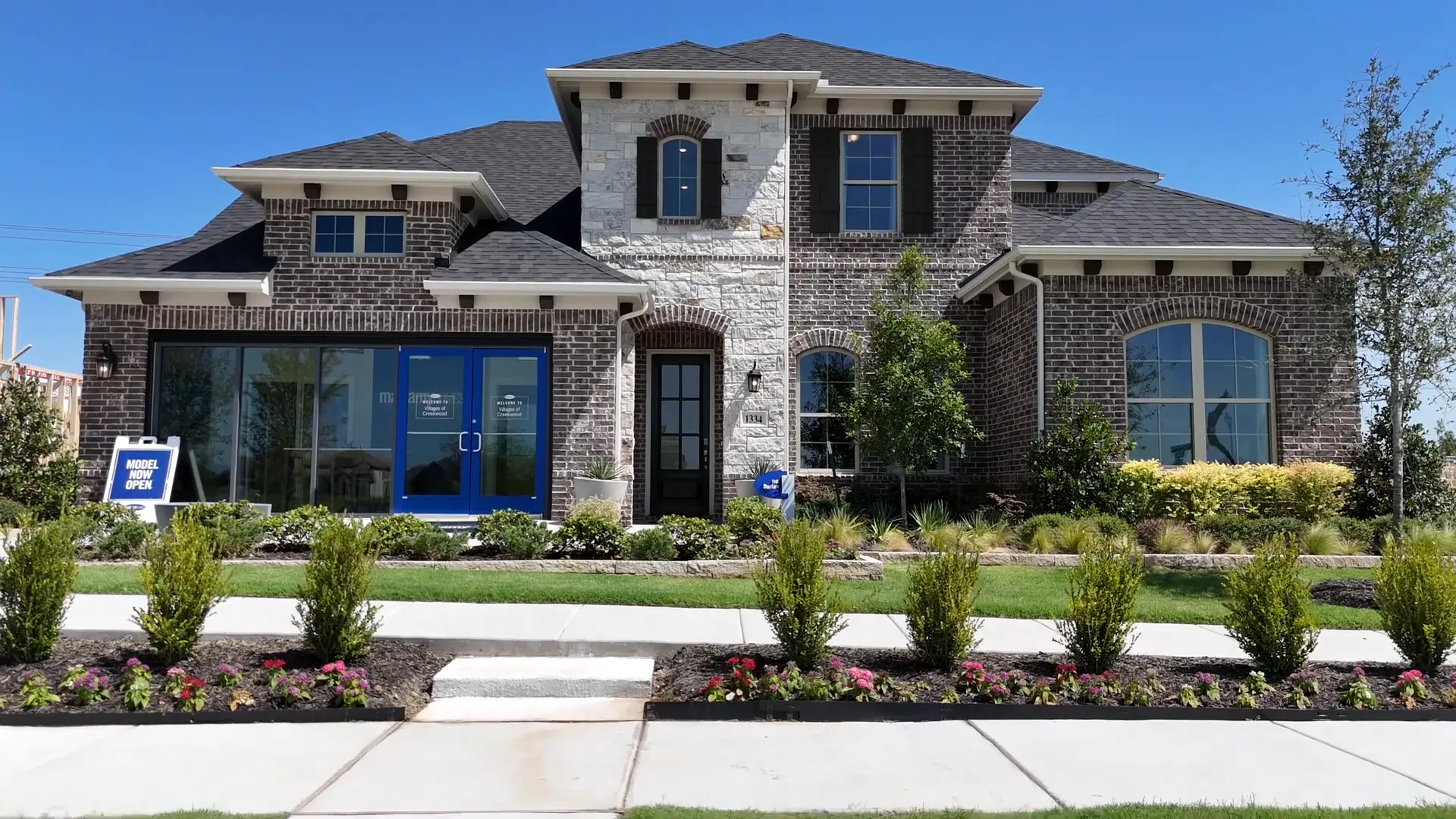 Model home exterior and community entrance signage