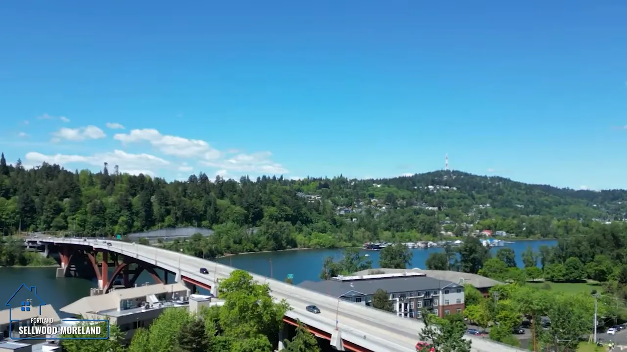 Aerial view of the Sellwood Bridge crossing the river with neighborhoods on both sides