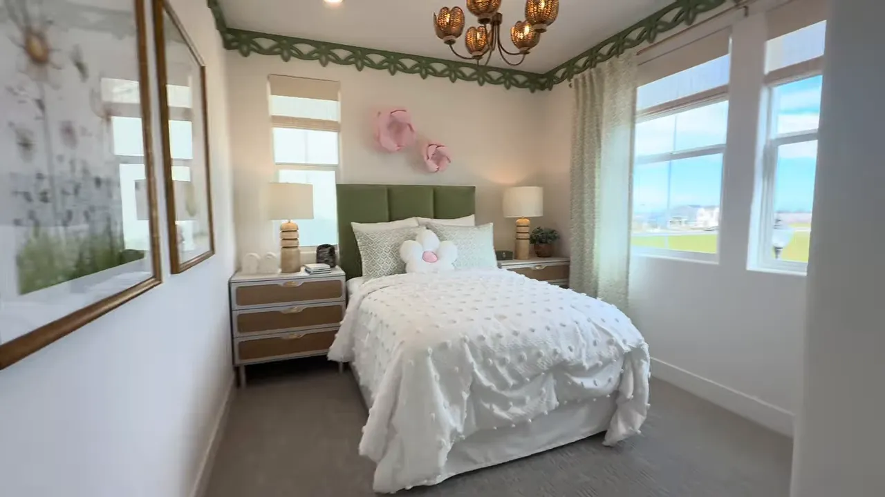 Secondary bedroom with window and built-in dresser in the Merrick floor plan at Ashbourne at Ellis in Tracy CA