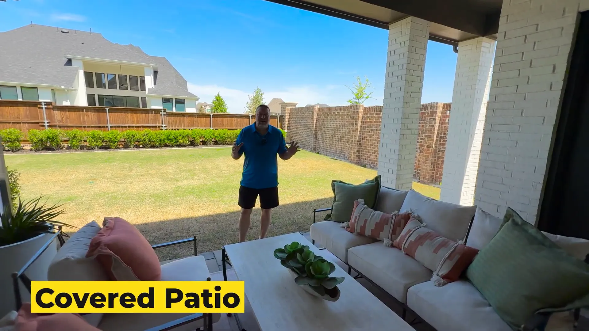 Covered patio and spacious backyard in Highland Homes 608 model