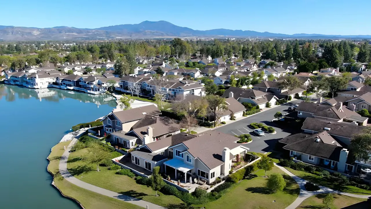 Aerial view of Lake Forest, California neighborhood homes and lakefront area