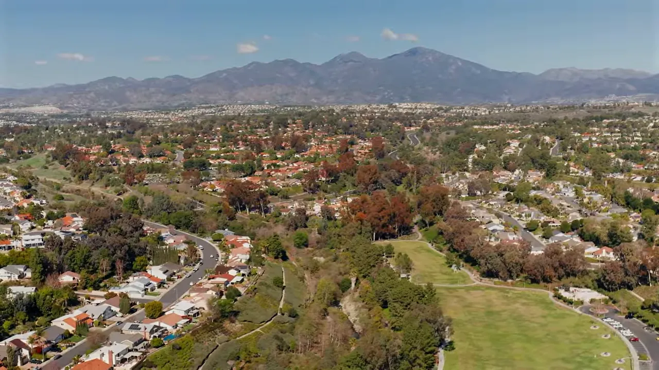 Aerial view of Orange County suburbs with hills in the background