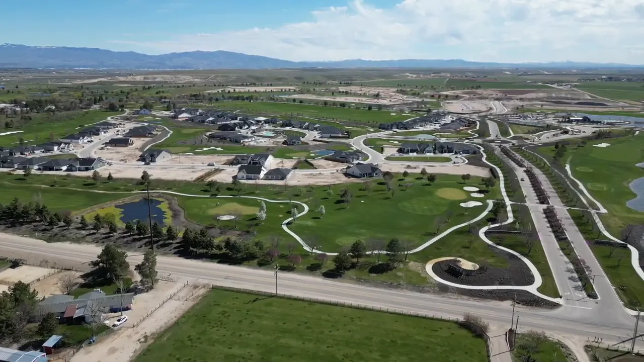 Aerial shot of the Valor community with golf course fairways, homes, walking paths and small ponds