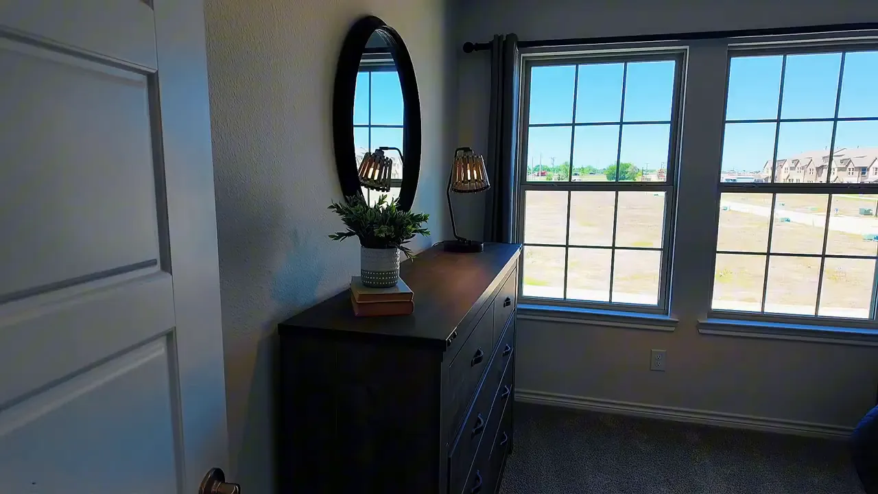 Upstairs room corner with large windows and built-in dresser