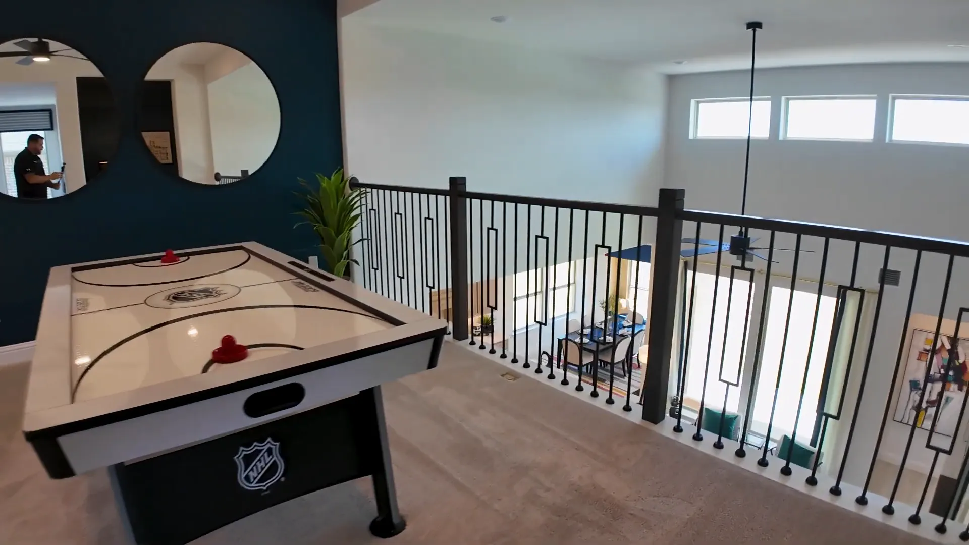 Upstairs game room with open railing