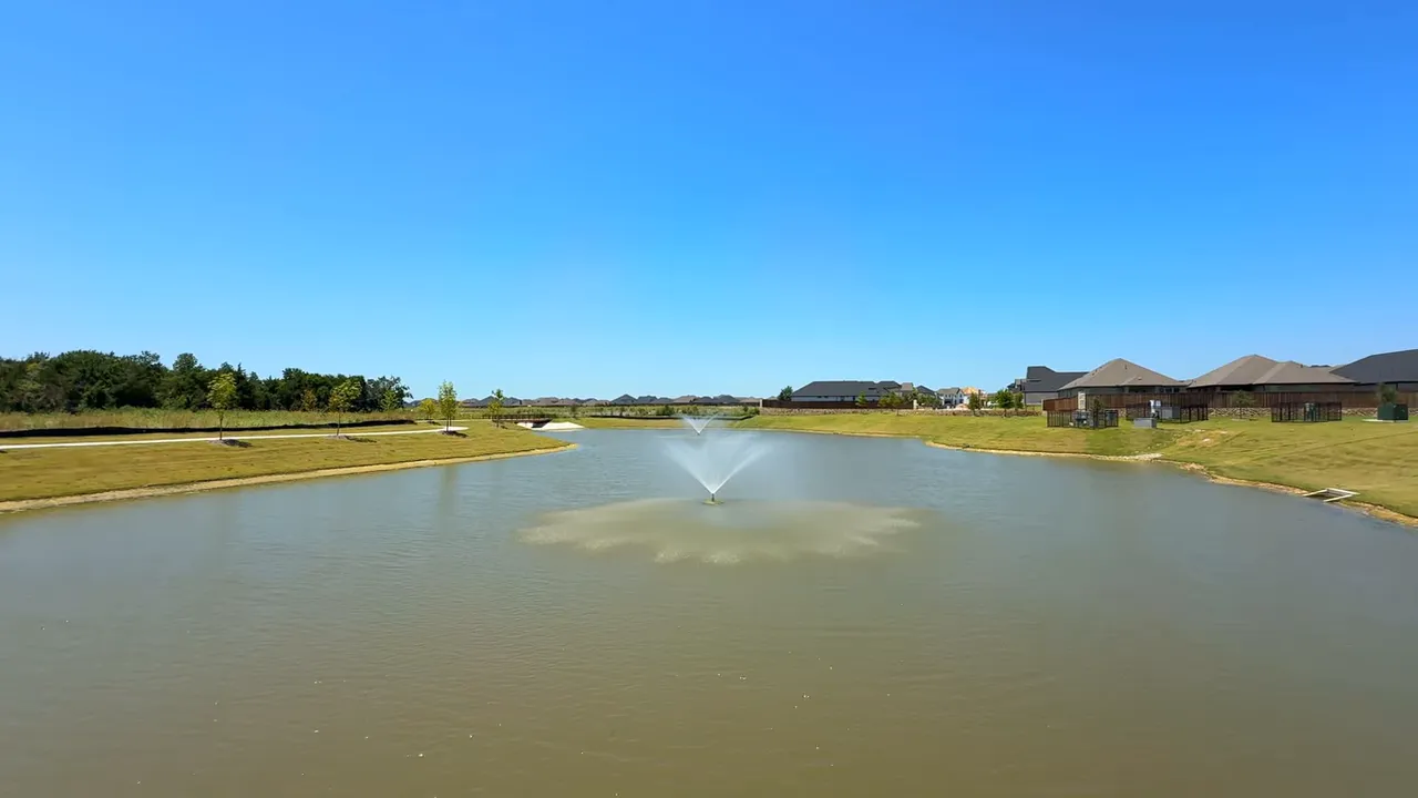 Sunrise Shores fishing dock lake with fountains at Elevon in Lavon TX