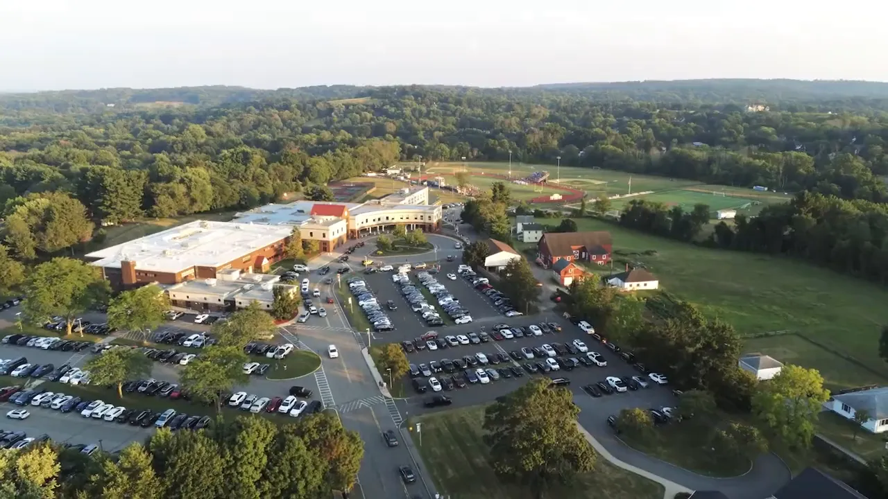 Aerial view of the Mendham High School campus with surrounding athletic fields and parking