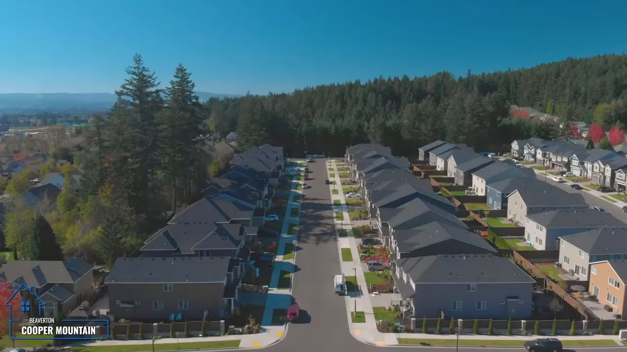 Aerial view of Cooper Mountain new home development beside forested hills