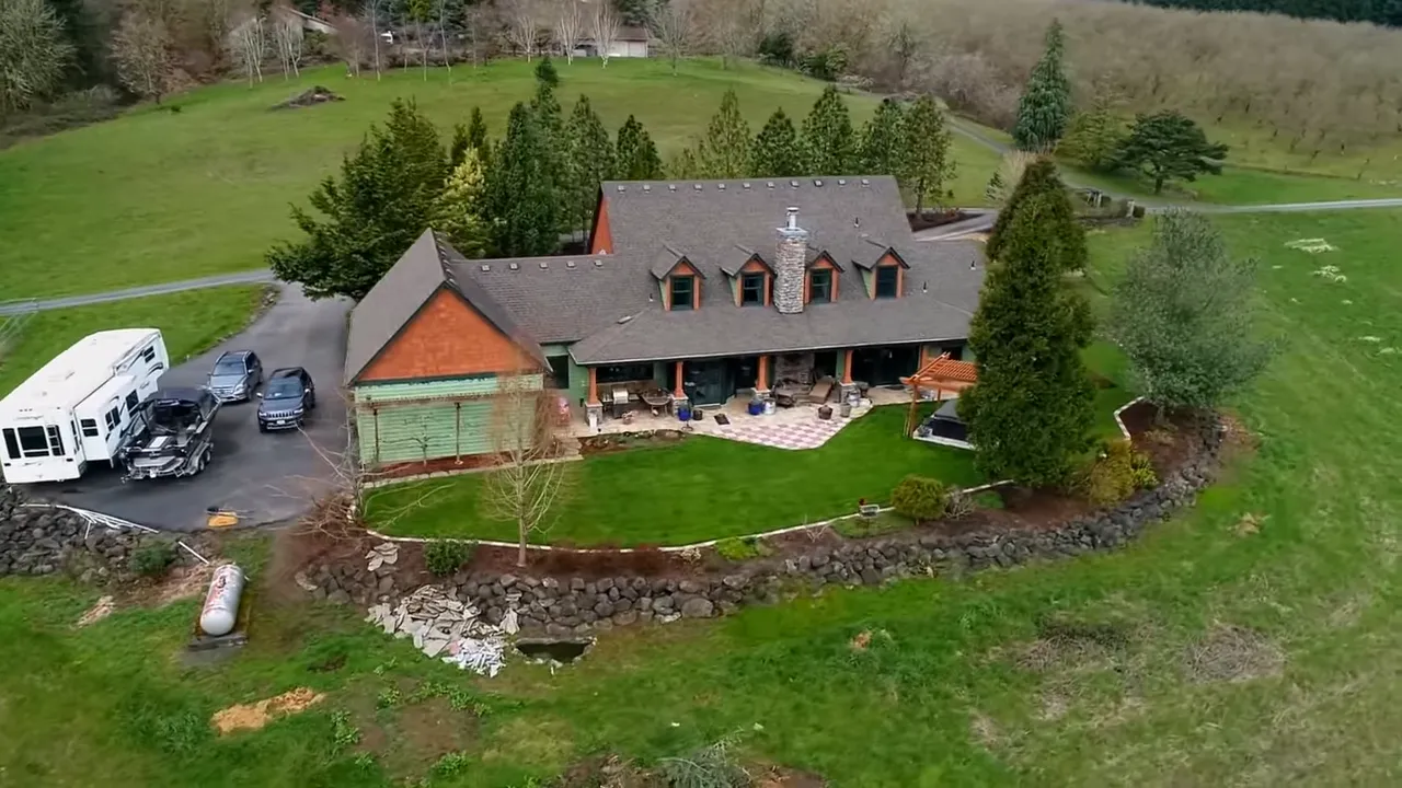 Large Sherwood acreage home with expansive lawn and covered front porch