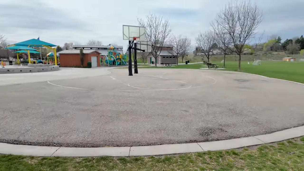 Playground and basketball court area at Stephen C. Guerber Park in Eagle, Idaho
