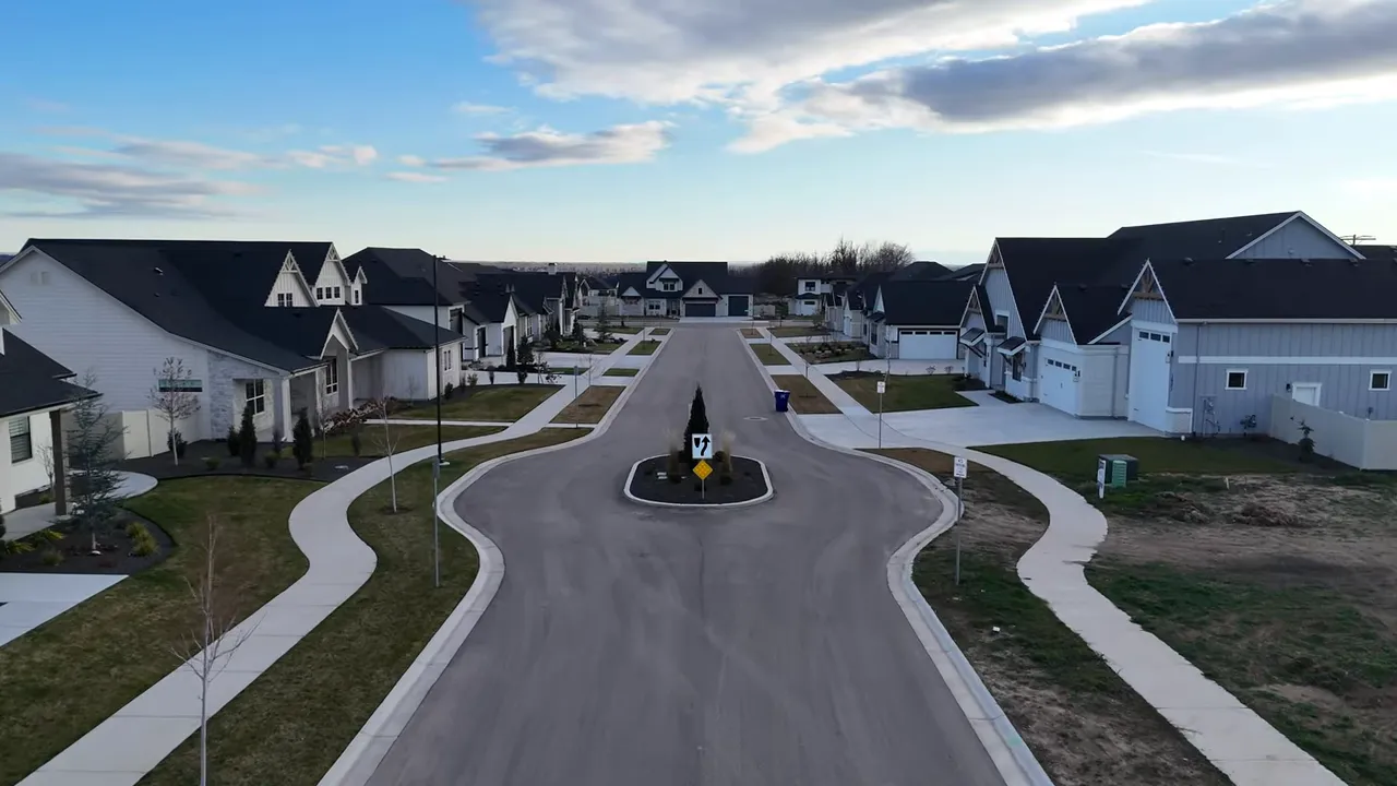 Road and drive loop in an Eagle Idaho housing community with large garages