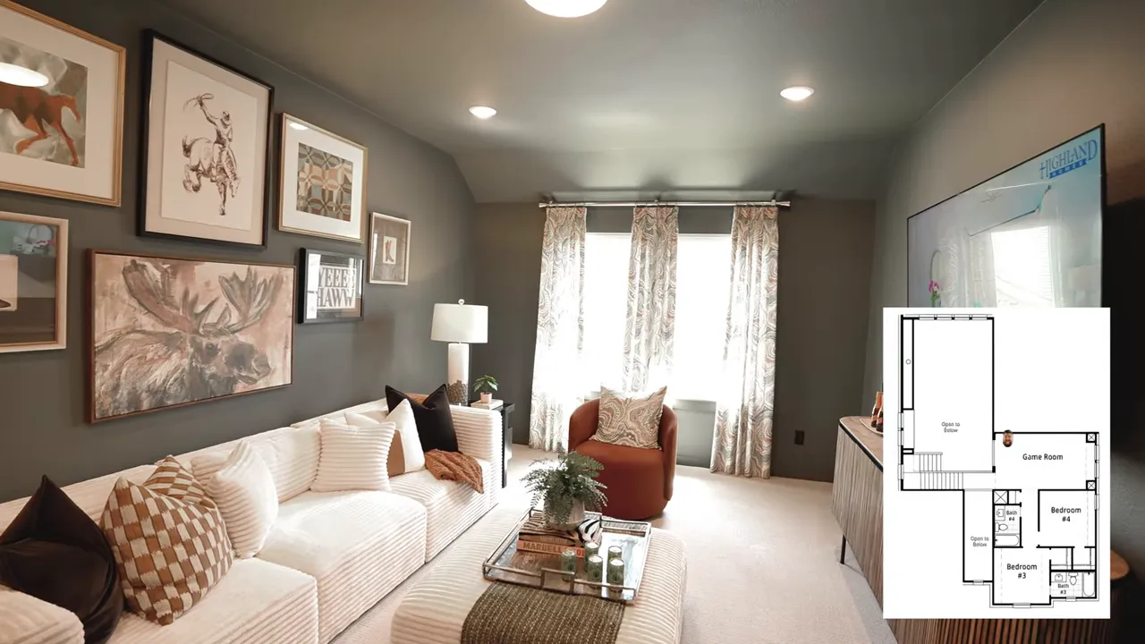 Dark painted media room with sofa gallery wall and television