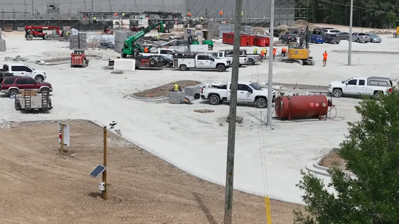 Aerial view of ongoing construction work and vehicles in a new Summers Corner SC neighborhood