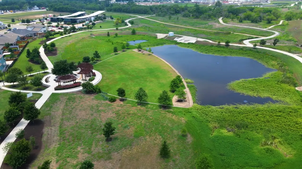 Aerial view of ponds trails green space and nearby homes