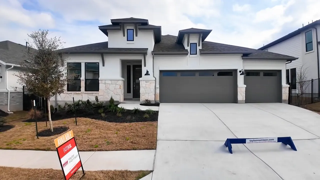 Single story inventory home with three car garage and stone exterior