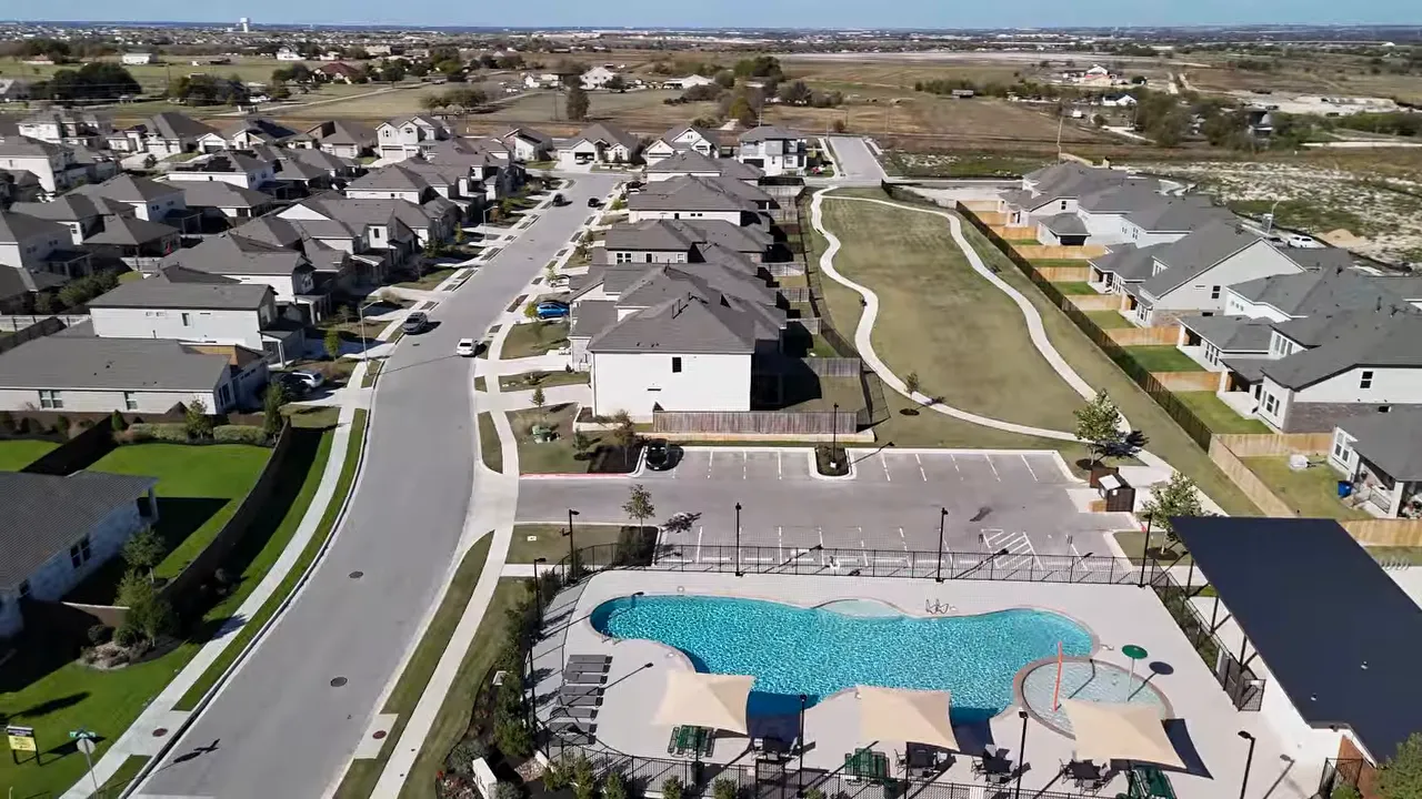 Aerial neighborhood view with property taxable value and combined tax rates text