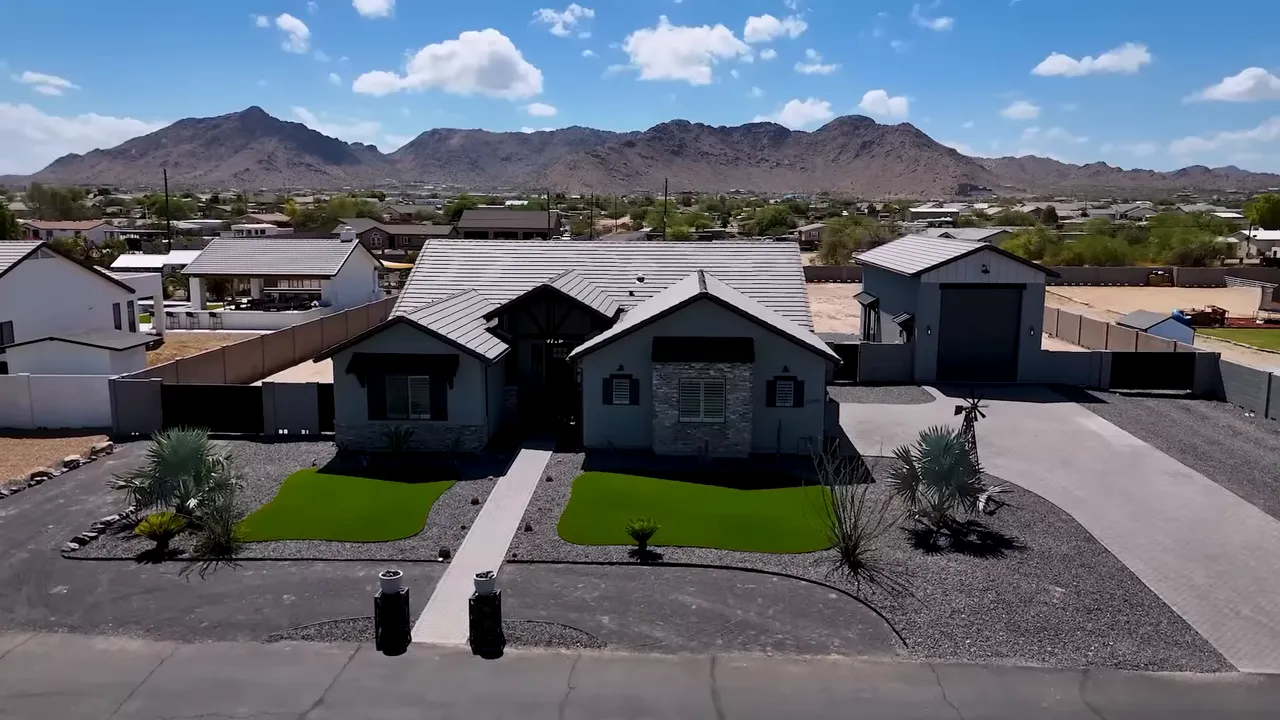 Aerial view of a modern home in the Phoenix area with mountains in the background