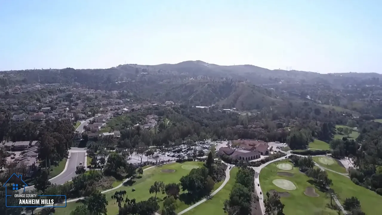 Wide aerial view of Anaheim Hills golf community and surrounding hills in Orange County CA