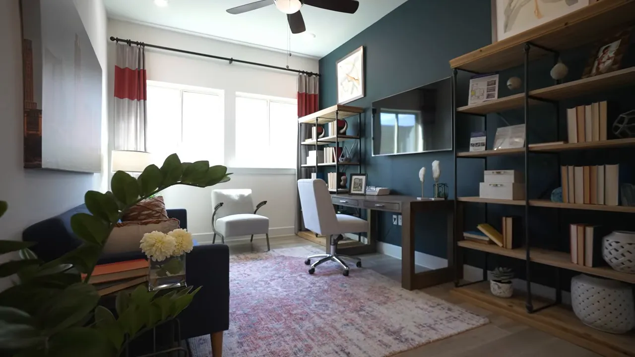 Front study room with shelving sofa chair and window