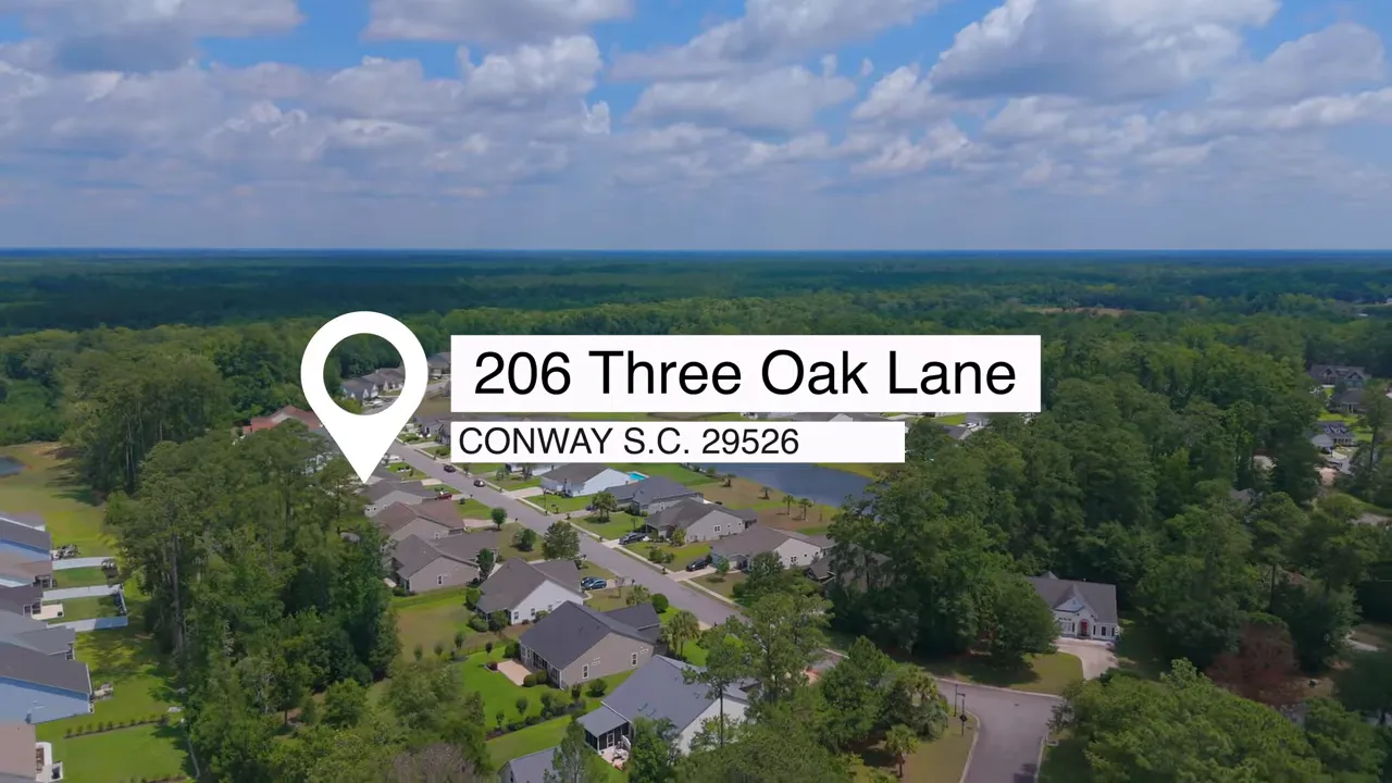 Aerial view of neighborhood with location pin over homes and nearby ponds