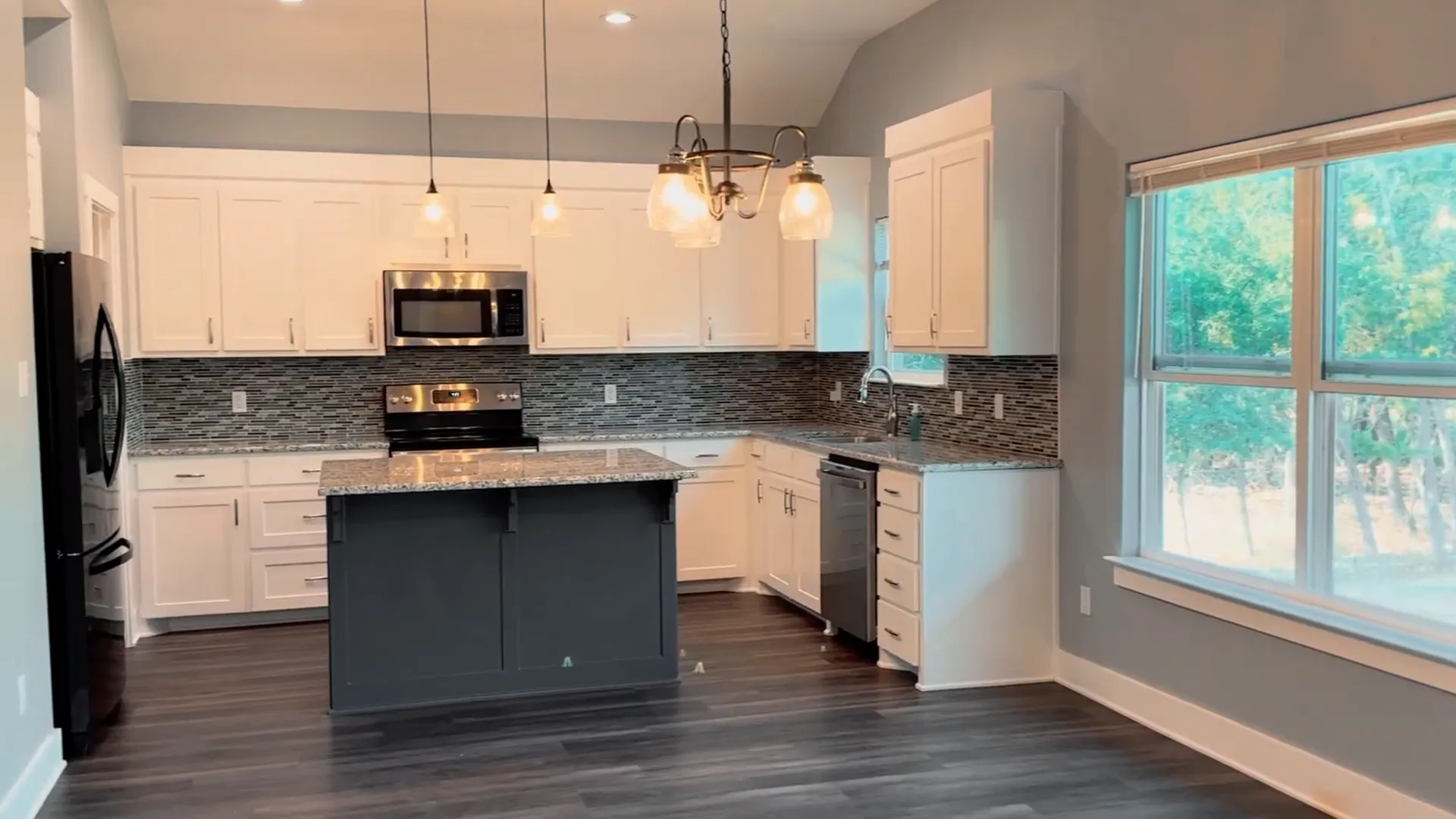 View of the kitchen with two-toned cabinets